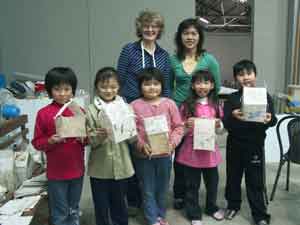 children with the houses they made, Jane and their teacher