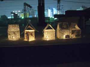 lanterns with city lights in the back