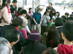 crowd watching the beating of fiber into pulp