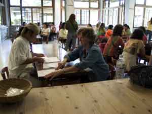 Jane meeting with Meow over papermaking studio