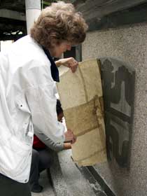 taking paper off temple symbol