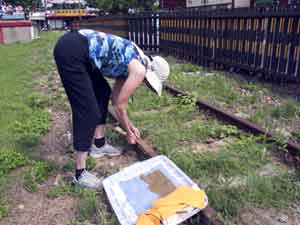Jane putting paper on tracks