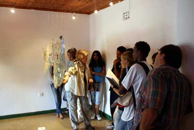 Jane talking to students in the gallery