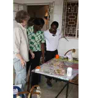 Staff helping Jane make the Tanzanian map