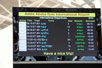 Addis Ababa Airport Departure sign . We are  flight ET801 to Kilimanjaro
