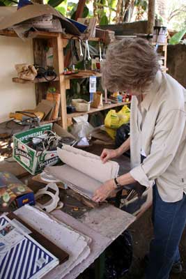 Jane looking at paper in Seppo's paper studio