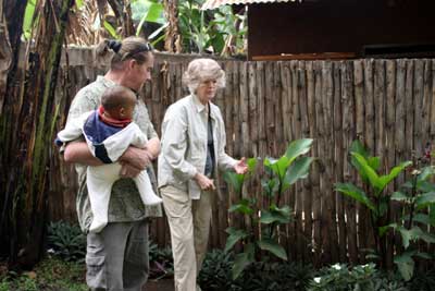 Seppo and Jane looking at canna leaves