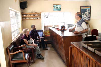 Pelle, Jane and Mr. Shariffee in his office